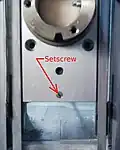 8. The slotted setscrew fastening the cylinder orienting pin in the sliding block.