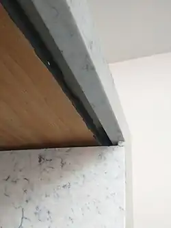 Some of the plywood will be permanently exposed. We painted those areas dark grey.