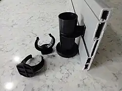 This is how the toe kick panels are attached to the legs. Notice the ring at the leg's bottom: it keeps the panel upright.