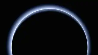 Haze of the atmosphere of Pluto.