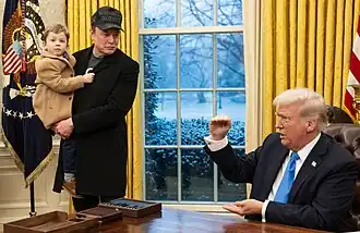 Elon Musk with his son in the Oval Office
