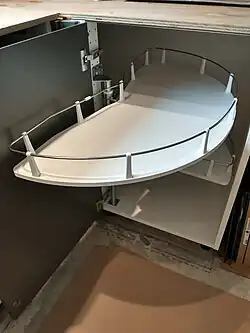 First the tray is turned 90 degrees around the axis (for partial access)…