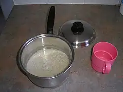 3. Pour water into saucepan. Remember—twice as much water as rice.