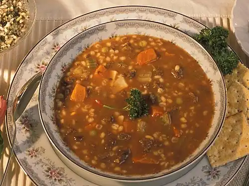 a bowl of vegetable beef barley soup