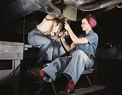 Women working to build aircraft during WWII.